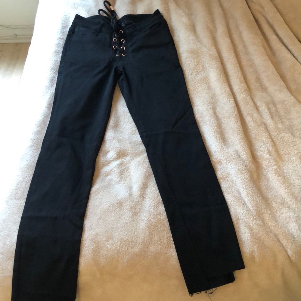 Criss cross detail black skinny jeans